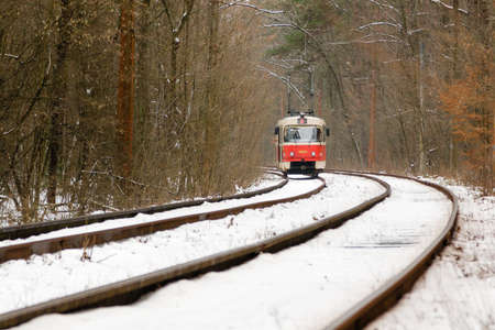 rushing tram through the winter forest close upの写真素材