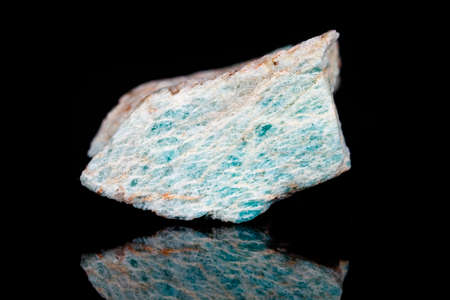 Macro mineral stone Amazonite on black background close up