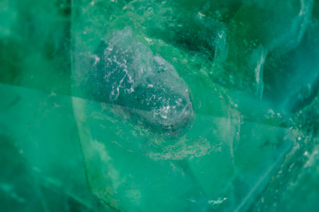 Macro mineral stone Fluorite crystal on a black background close-up