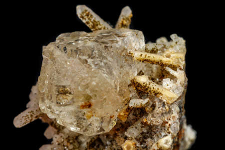 Macro mineral stone fluorite with quartz against black background close up