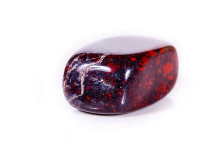Macro mineral stone jasper hematite on white background close up