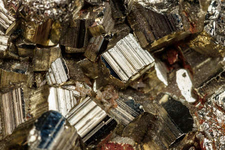 Macro mineral stone Pyrite on a black background close-upの写真素材