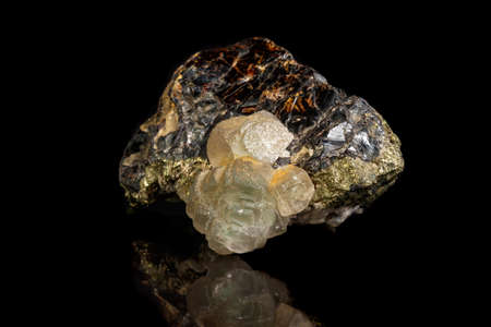 Macro of a mineral stone Sphalerite with fluorite and pyrite on a black background close upの写真素材