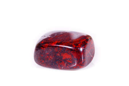 Macro mineral stone jasper hematite on white background close up
