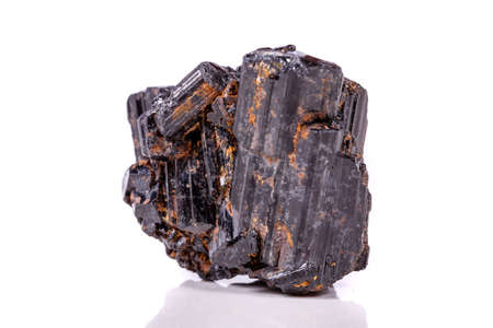 macro mineral stone sherle, schorl, black tourmaline on white background close-upの写真素材