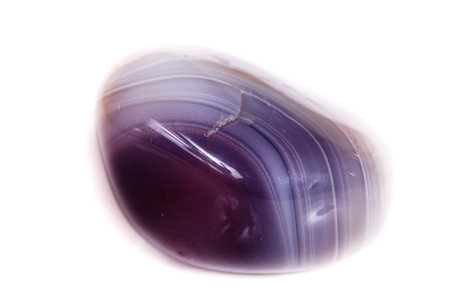 Macro mineral stone Agate Botswana gray on white background close up