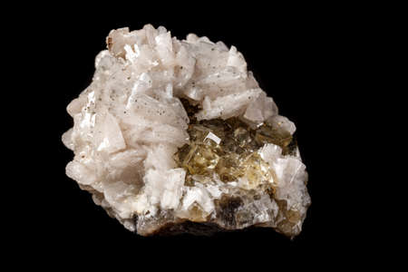 Macro mineral stone Baryta On Fluorite On a black background close-up