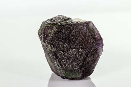 macro mineral fluorite stone on white background close up