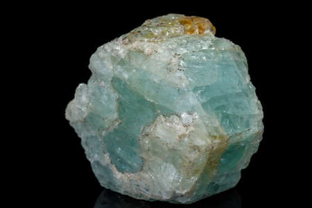 macro mineral stone aquamarine on a black background close up