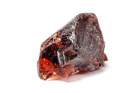 Macro mineral stone Garnet Spessartine on a white background close up