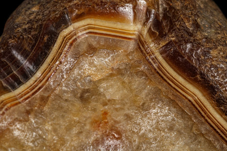 macro stone mineral agate on black background close up