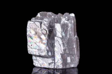 Macro mineral stone Iceland spar on black background close up
