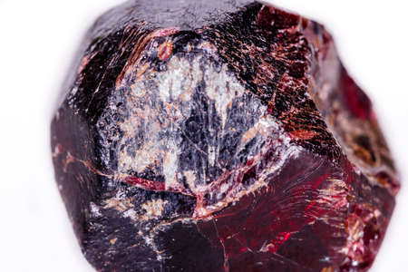 Macro of a mineral garnet stone on a white background close upの写真素材