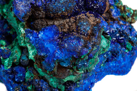 Macro mineral stone malachite with azurite on white background close upの写真素材