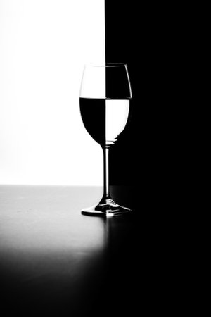 a glass of water and smoke on a black and white background close upの写真素材