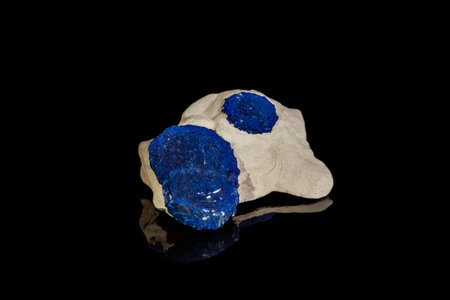 Macro mineral stone Azurite in siltstone against black background close upの写真素材