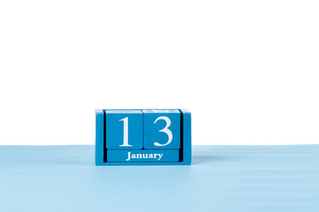 Wooden calendar January 13 on a white background