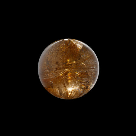 Ball of quartz with rutile on a black background close-upの写真素材