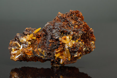 macro mineral Wulfenite stone on a black background close-up