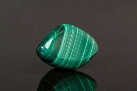 macro mineral stone malachite on a black background