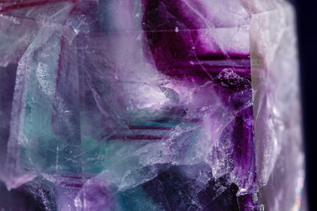 Macro mineral stone Fluorite crystal on a black background close-up