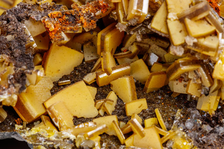 Macro mineral stone yellow Wulfenite on a white background close-upの写真素材