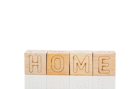 Wooden cubes with letters home on a white background close-upの写真素材