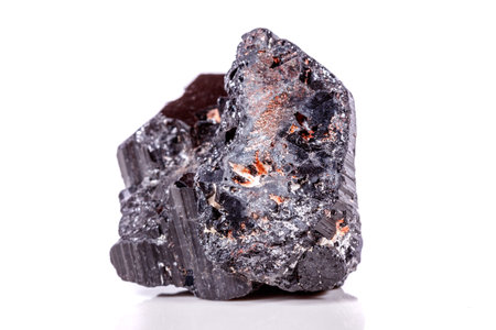 macro mineral stone sherle, schorl, black tourmaline on white background close-upの写真素材