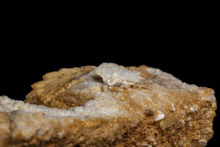 Macro mineral stone Snow quartz with calcite on a black background close up