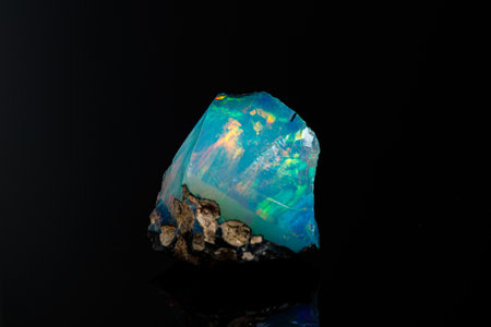 macro mineral stone rare and beautiful opals on a black background close-up