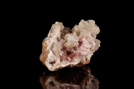 Macro mineral stone Pink Amethyst on a black background close up