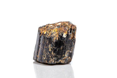 macro mineral stone sherle, schorl, black tourmaline on white background close-upの写真素材