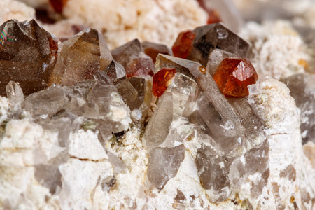 Macro mineral stone Spessartine, Feldspar, Smoky quartz, on a white background close upの写真素材