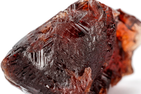 Macro mineral stone Garnet Spessartine on a white background close up