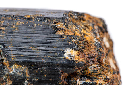 macro mineral stone sherle, schorl, black tourmaline on white background close-upの写真素材