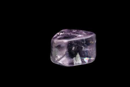 Macro mineral stone spodumene kunzite black background close upの写真素材