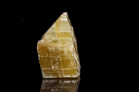 Macro mineral stone yellow Calcite on a black background close upの写真素材