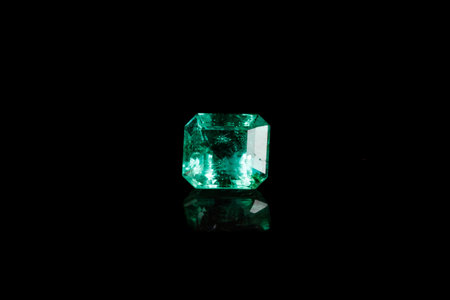 Macro mineral Emerald gemstone faceted on black background close upの写真素材