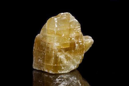Macro mineral stone yellow Calcite on a black background close upの写真素材