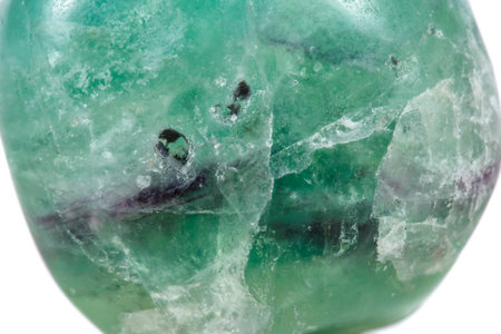 Macro mineral stone Fluorite crystal on a black background close-up