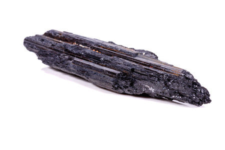 macro mineral stone sherle, schorl, black tourmaline on white background close-upの写真素材