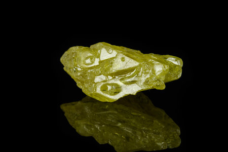 Macro mineral sulfur stone on a black background close up