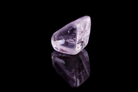 Macro mineral stone spodumene kunzite black background close upの写真素材