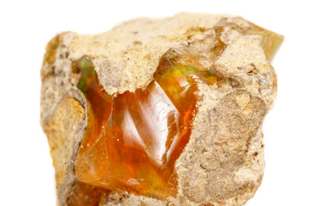 Macro Opal mineral stone in rock on white background close up