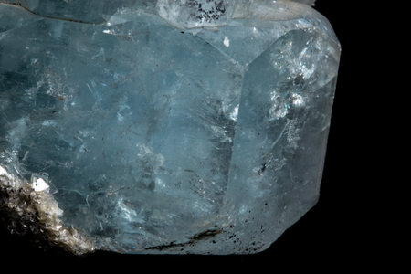 Macro mineral stone Aquamarine on a black background close up