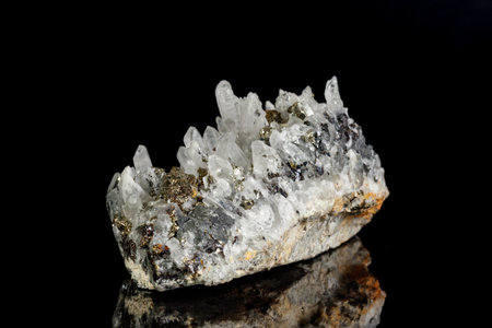 Macro mineral stone Galena, Sphalerite, Pyrite, Quartz on a black background close-upの写真素材