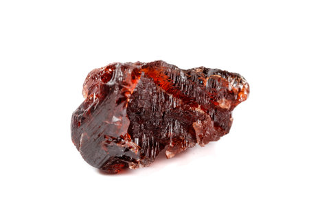 Macro mineral stone Garnet Spessartine on a white background close up