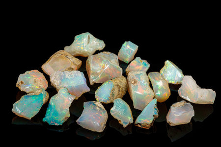 macro mineral stone rare and beautiful opals on a black background close-up