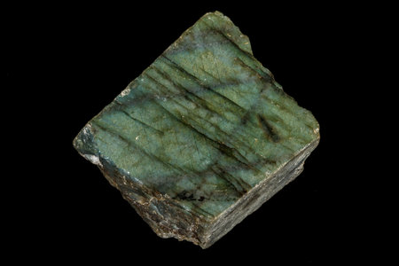 Macro of the stone Labradorite mineral on a black background close up