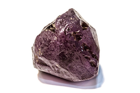 Macro of Alexandrite mineral stone in rock on white background close up
